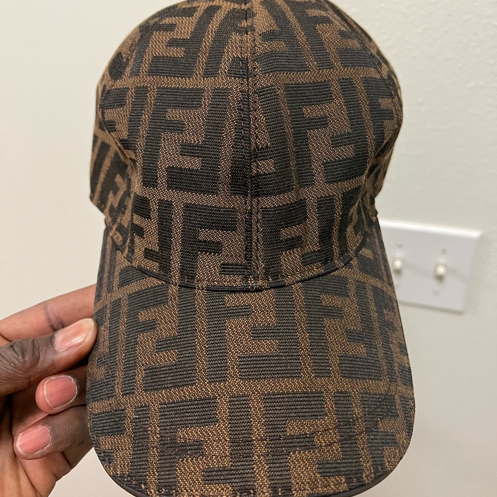 Brand new fendi cap. Never worn. Does not come with a box will package it well.